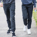 Charcoal marle fleece joggers with cuffed ankles worn by two people outdoors