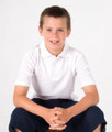 White short sleeve polo shirt with collar and button placket worn with navy pants