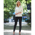 Black slim-fit tregging pants paired with white collared shirt, showcasing streamlined silhouette and fitted leg design