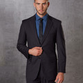 Charcoal grey corporate blazer with notch lapels worn over cobalt blue dress shirt and tie