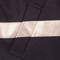 Close-up of navy wool blend jacket with cream satin 3M reflective tape panel and belt loop detail