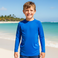 A plain kids' unisex long sleeve rashie top (230gsm), made from a blend of Polyester and 13% Spandex. This rashie is designed for water activities, featuring vibrant colours with sun protection.