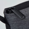 Charcoal grey insulated wine cooler bag with black zipper and branded pull tab detail