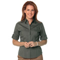 Olive green women's military shirt with button front, chest pockets with flaps, and roll-up sleeves