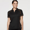 Women's black sports polo with orange contrast piping, open collar, raglan-style panels, worn by female model