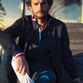 Navy heavy knit zip-up jacket with red, white and blue contrast trim on hood, cuffs and hem