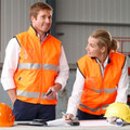 High-visibility orange safety vest with silver reflective tape and mandarin collar featuring full-length zip closure