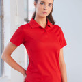 Woman wearing a red short sleeve polo shirt with flat front panel and two-button placket