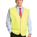 Man wearing fluorescent yellow safety vest with reflective trim over shirt and tie