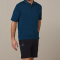 Navy blue polo shirt with collar and button placket paired with black cargo shorts