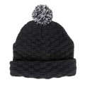Black knit beanie with textured basket weave pattern and contrasting speckled pom pom on top
