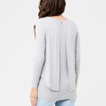 Model wearing silver marle striped long sleeve nursing top, rear view showing inverted pleat swing back detail