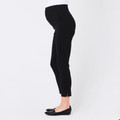 Model wearing black maternity capri pants with wide belly panel and ankle split hem, side profile view