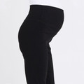 Black maternity capri pants with wide fold-over waistband shown in side profile view