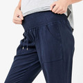 Navy maternity pants with elasticated smocked waistband, drawstring ties, and angled front pockets in soft Tencel fabric