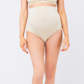 Model wearing natural seamless high-waisted maternity briefs with smooth stretch panel front