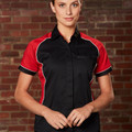 Black short sleeve shirt with red contrast panels and white piping detail on shoulders and sleeves