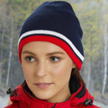 Navy acrylic beanie with red and white contrast stripes on ribbed cuff