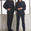 Navy trackpants with gold piping detail along side seams, elastic waistband and cuffs, side pockets