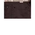 Close-up of dark brown hi-vis rain jacket chest pocket with snap buttons and 3M Scotchlite reflective label, orange contrast panel visible