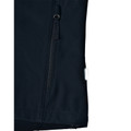 Close-up of navy softshell jacket hem showing angled zip pocket, woven loop pull and white care label