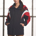 Woman wearing navy hooded jacket with red and white contrast panels on shoulders and sleeves, longline fit