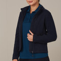 Navy bonded polar fleece jacket with full zip and fitted silhouette over teal polo shirt