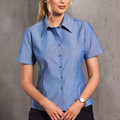 Chambray blue short sleeve shirt with collar and button front closure in wrinkle-resistant fabric