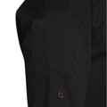 Close-up of black chef jacket sleeve with chest pocket and single button cuff detail