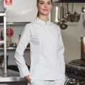 White long sleeve chef jacket with mandarin collar and press stud closure worn in commercial kitchen