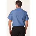 Periwinkle blue short sleeve work shirt shown from back with black trousers
