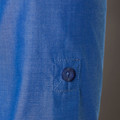 Royal blue dress shirt sleeve with visible button detail and matching stitched placket