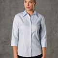 Woman wearing pale blue self-stripe button-up shirt with point collar and 3/4 sleeves