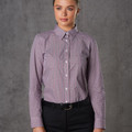 Woman wearing a burgundy and white mini gingham long sleeve shirt with button-down collar and button front