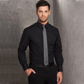 Male model wearing a black long sleeve stretch shirt with concealed placket, point collar and barrel cuffs