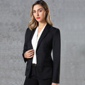 Black wool blend stretch jacket with notched lapel collar and single button closure worn over white blouse