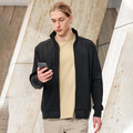 Black bomber jacket with stand collar and zip closure over cream turtleneck