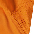 Bright orange high-visibility safety shirt showing breathable mesh panel detail with perforated ventilation pattern
