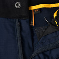 Navy rip-stop work shorts with exposed zipper detail and golden yellow contrast trim visible at waistband