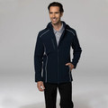 Navy softshell jacket with grey piping detail, hood, and front zip pockets on male model