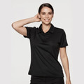 Woman wearing a black short-sleeve polo shirt with three-button placket and textured mini waffle knit fabric