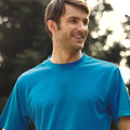 Man wearing a royal blue crew neck quick dry micromesh tee in an outdoor setting