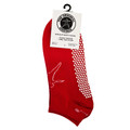 Red ankle socks with white non-slip grip dots on sole and underfoot, hanging on retail packaging