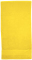 Flat lay of a sunflower yellow cotton velour beach towel with woven border hem