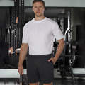Man in gym wearing charcoal casual shorts with side pockets and elasticated waist