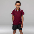 Boy wearing maroon kids polo shirt with white tipping on collar and sleeve cuffs