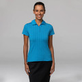 Woman wearing a cyan blue ladies polo shirt with subtle tone-on-tone diamond jacquard texture and flat collar