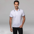 White polo shirt with navy contrast collar and sleeve trims, moisture-wicking performance fabric