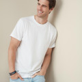 Man wearing a white tubular crew neck t-shirt with short sleeves, relaxed fit, smooth chest panel ideal for decoration