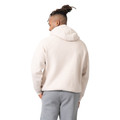 Rear view of pale pink oversized hoodie with grey sweatpants showing relaxed fit and dropped shoulders